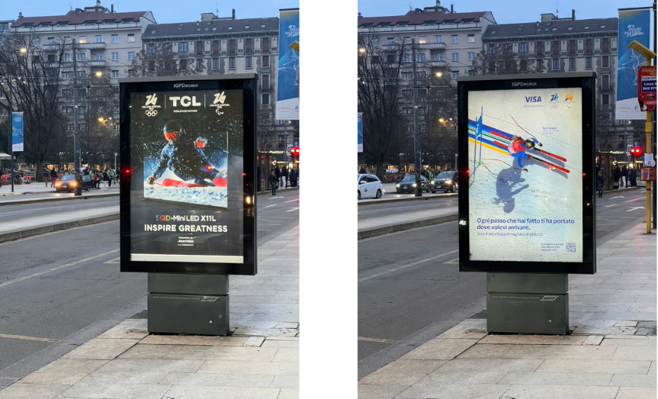 Digital out-of-home display in Milan rotating between TCL and Visa Milano Cortina 2026 Winter Games advertisements, featuring winter sports imagery and Olympic branding along a busy city street.